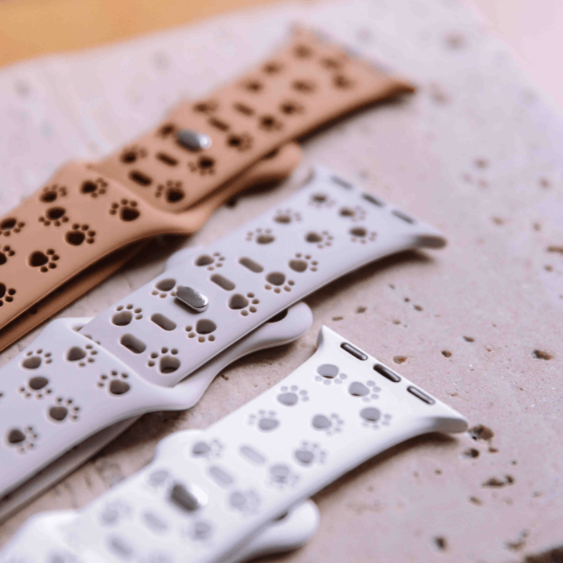 Close-up of animal print Apple Watch bands in various colors
