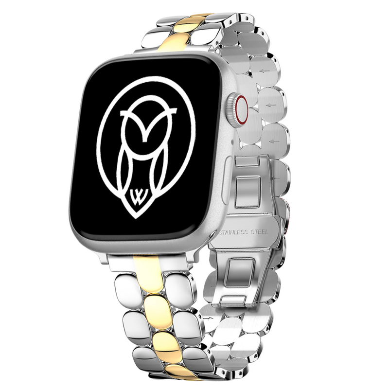  Gold stainless steel Apple Watch band with a honeycomb design, worn with layered bracelets on a wrist.