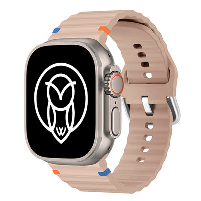 Beige ultra watch band styled with an Apple Watch Ultra.