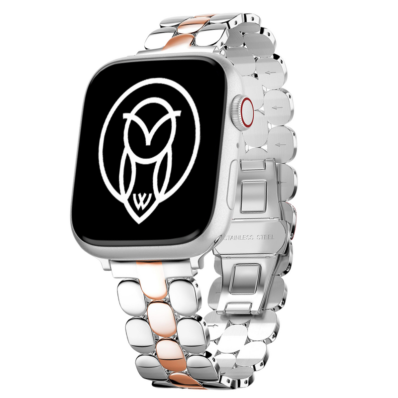 Two-tone gold and silver stainless steel Apple Watch band displayed upright with a black watch face.