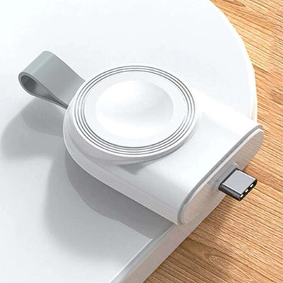 portable wireless apple watch charger on a laptop