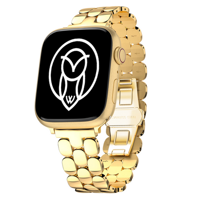 Gold stainless steel Apple Watch band displayed upright with a black watch face.